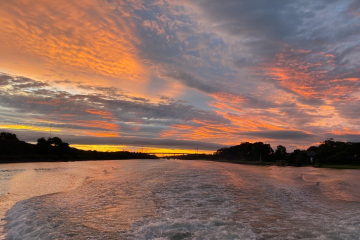a sunset over a body of water