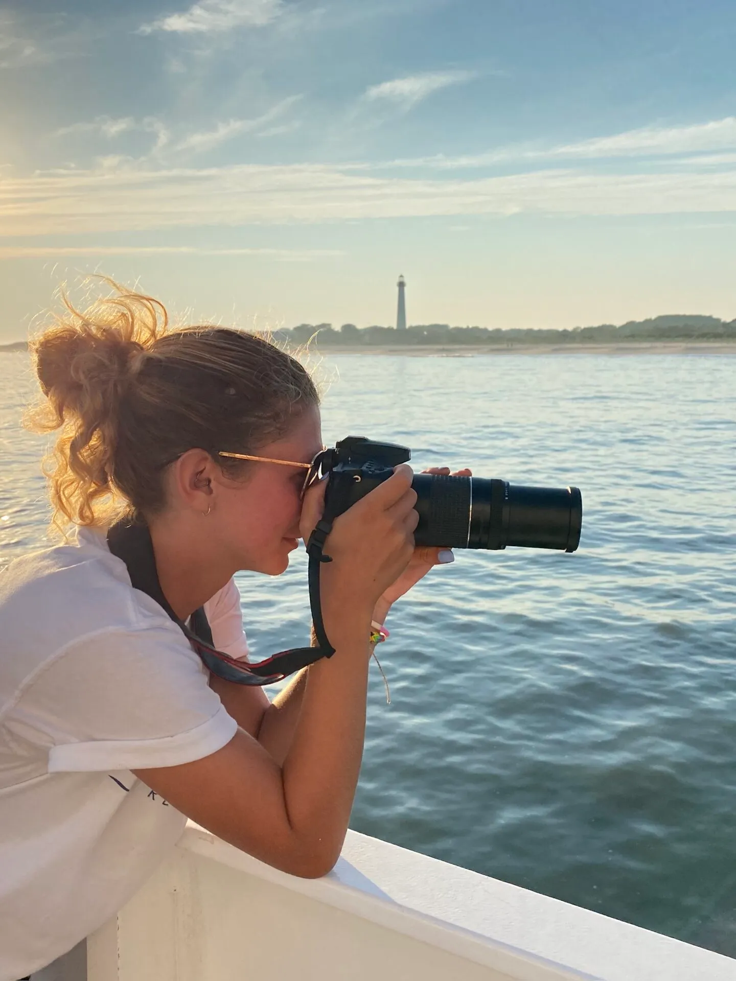 a person standing next to a body of water