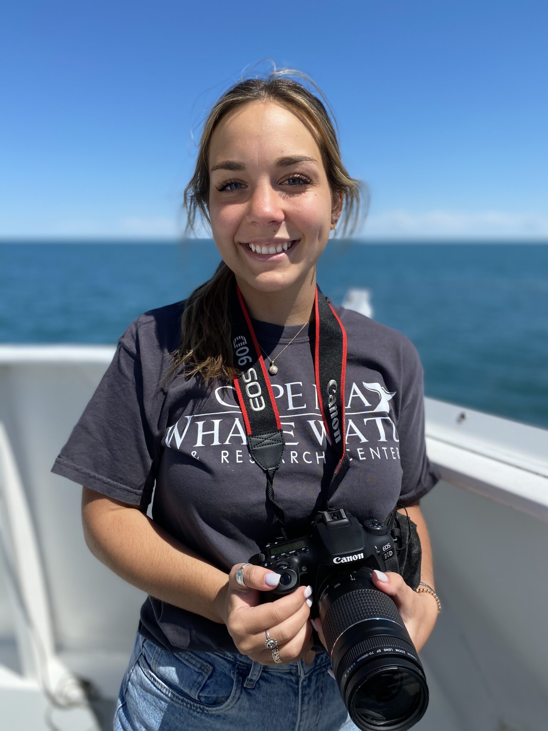 a person standing next to a body of water