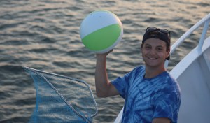 a person standing next to a body of water