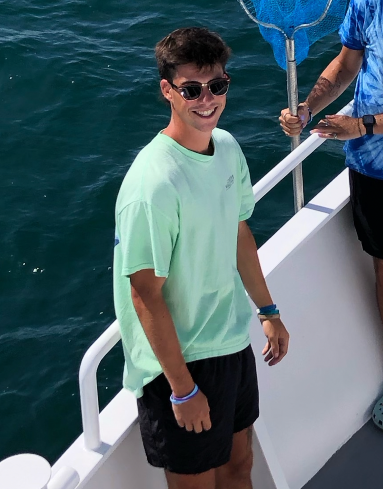 a man standing on a boat in the water